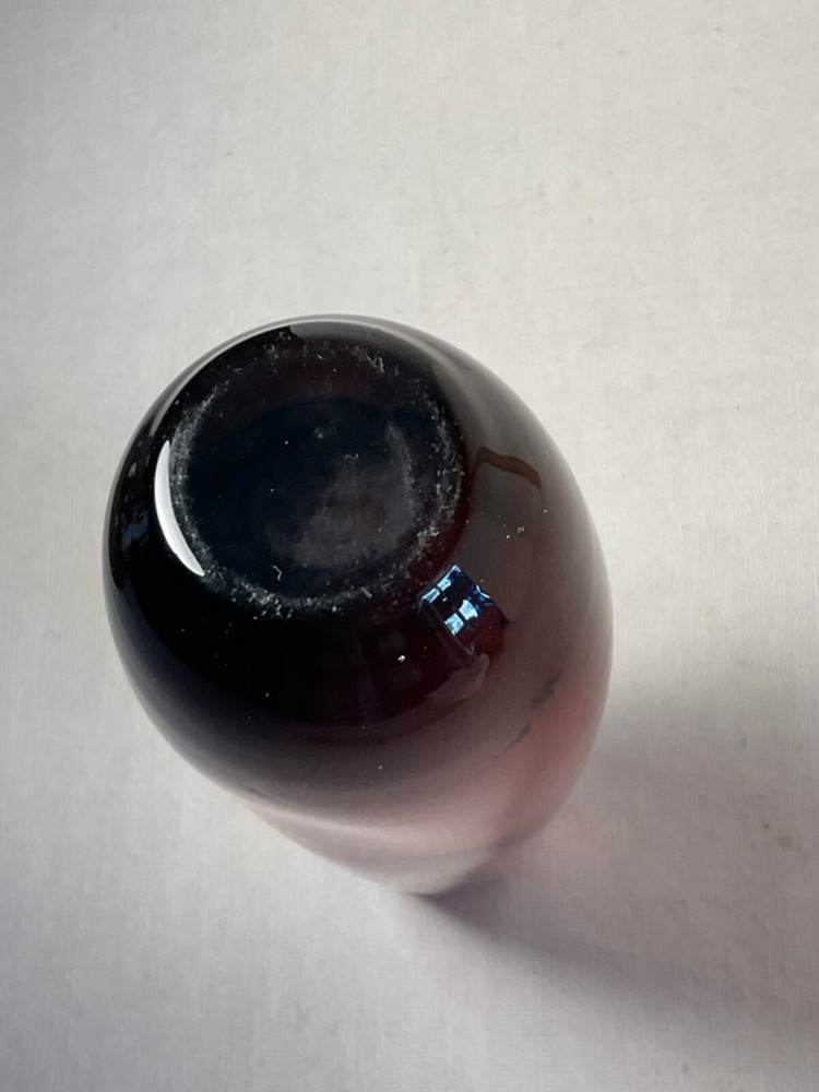 Cranberry colored vase clear bottom 7 1/4”