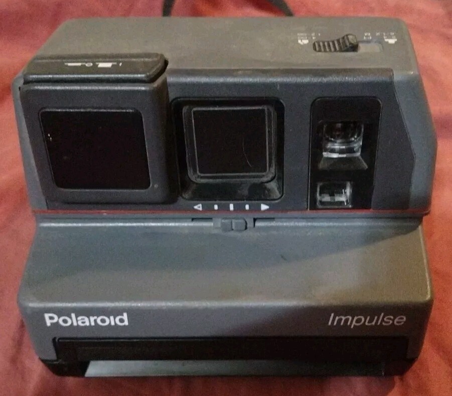 Polaroid Impulse Instant Camera With Strap.  Missing Eye Rubber Cover Tested