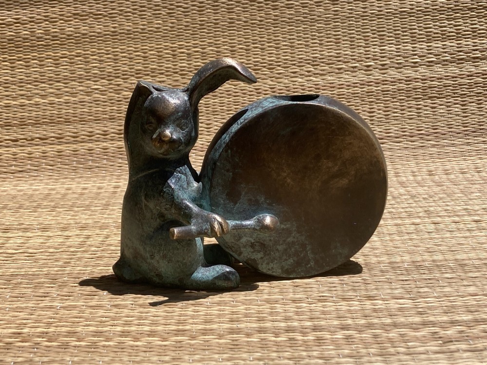 Bunny Vase drumming on a drum