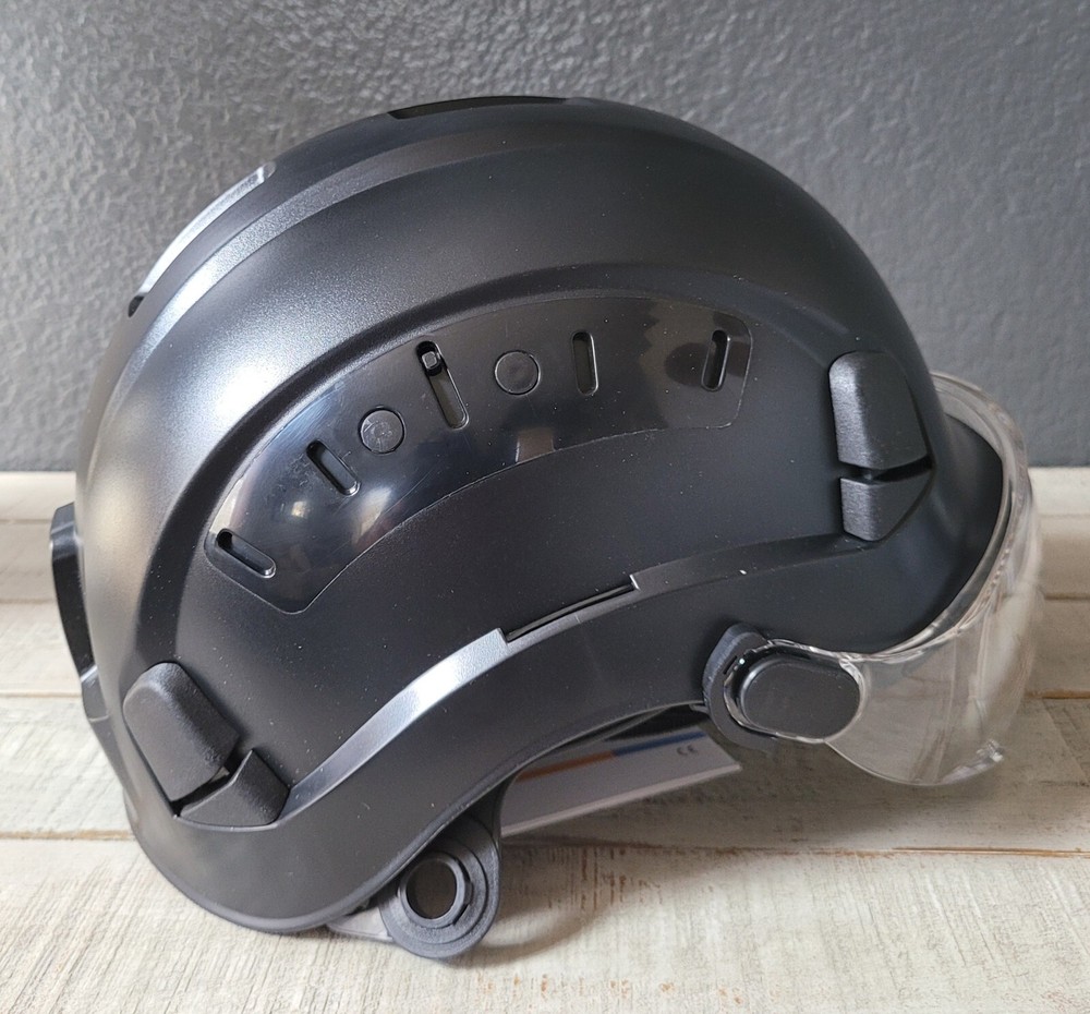 Arborist climber helmet with eye protection visor.
