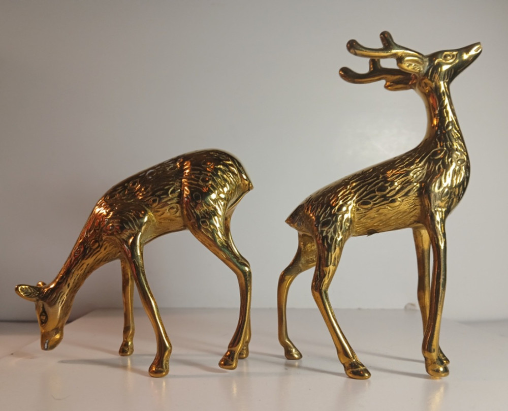 2 Solid Brass Deer. Distributed by Montgomery Ward.