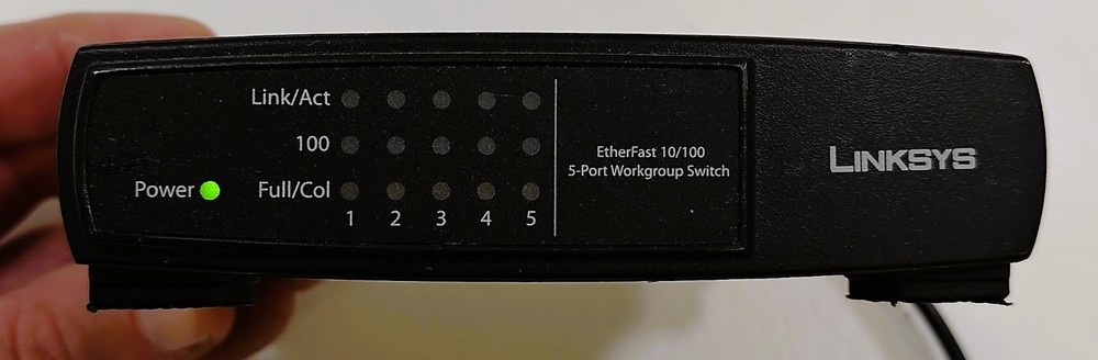 Linksys  EtherFast 5-Port 10/100 Workgroup Switch. Model No. EZXS55W
