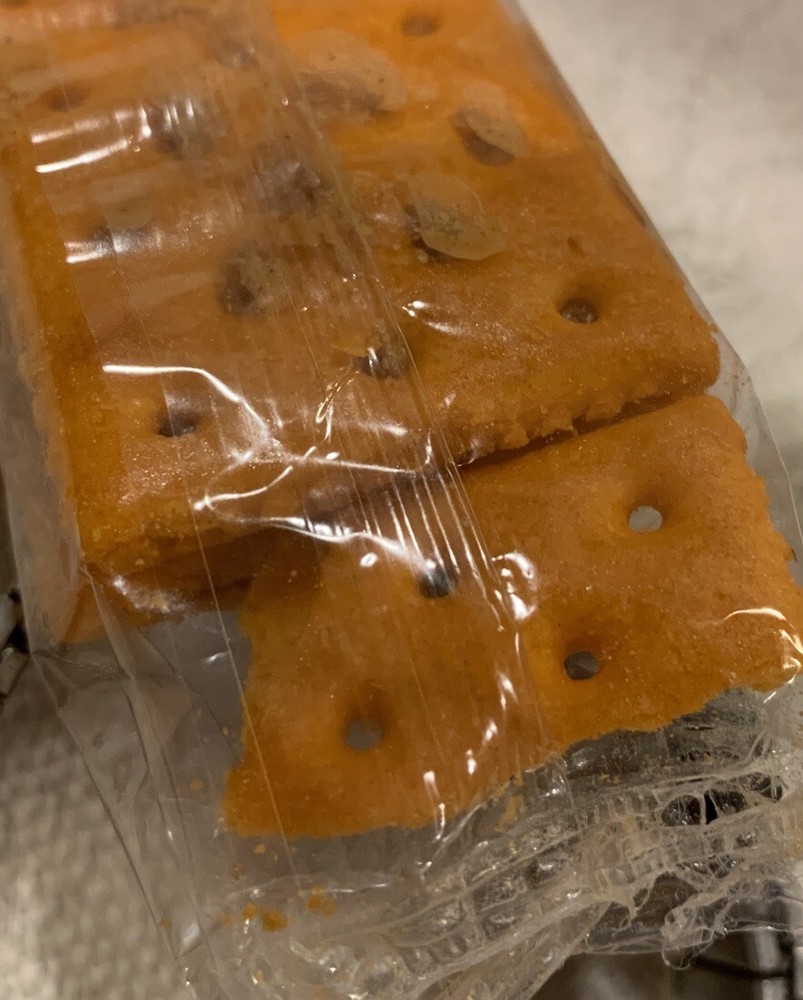 Manufacturing Error Four Pack Of Crackers With Extra Part Of Cracker In Pack