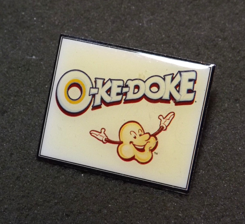 O-Ke-Doke Popcorn Lapel Pin Advertisement