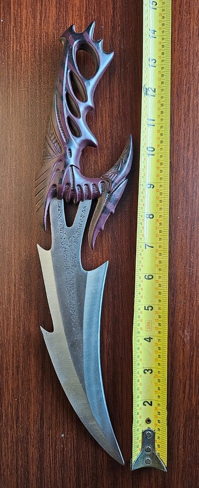 Fantasy Dragon Claw Dagger with Intricate Handle Design