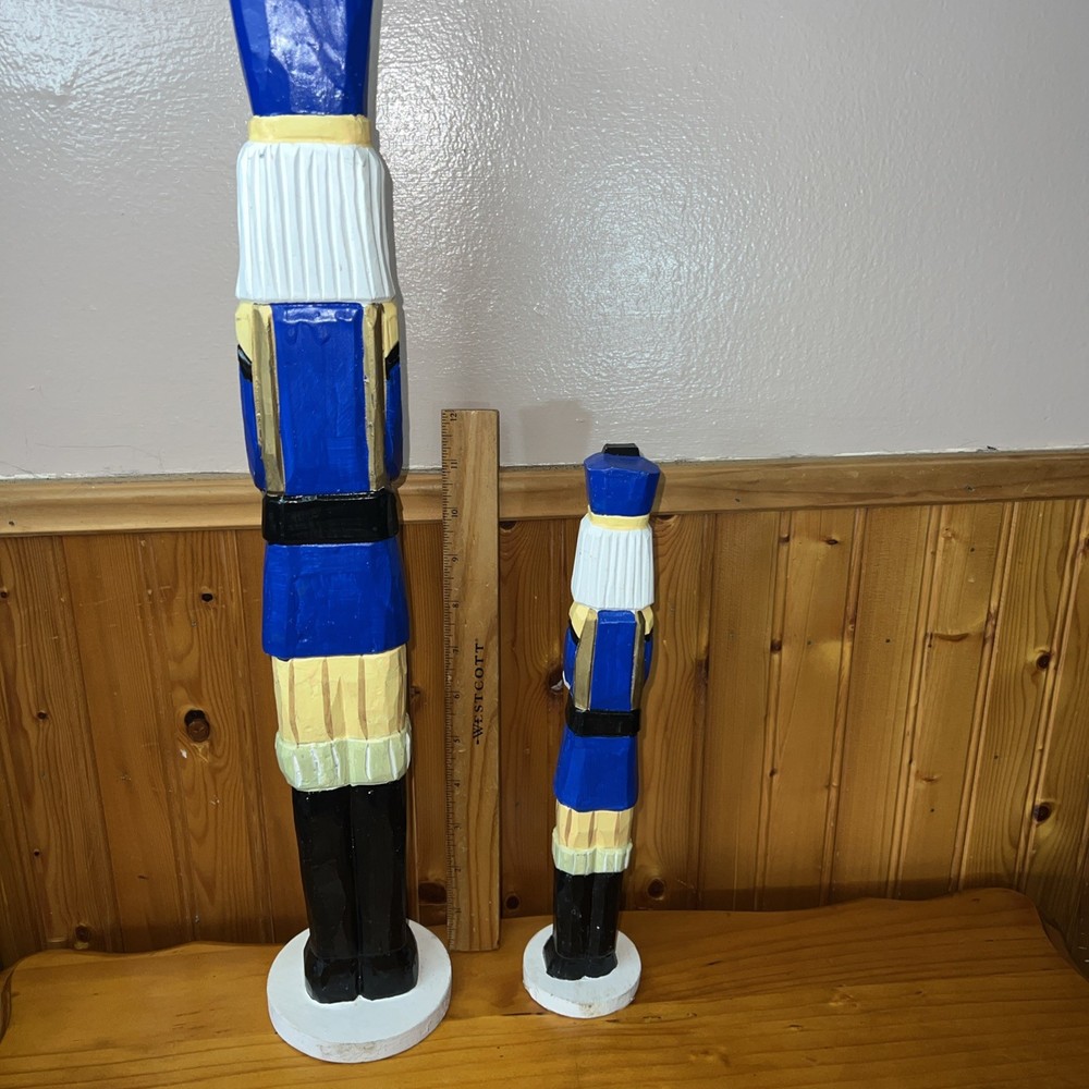 2 Tall decorative nutcracker figurines