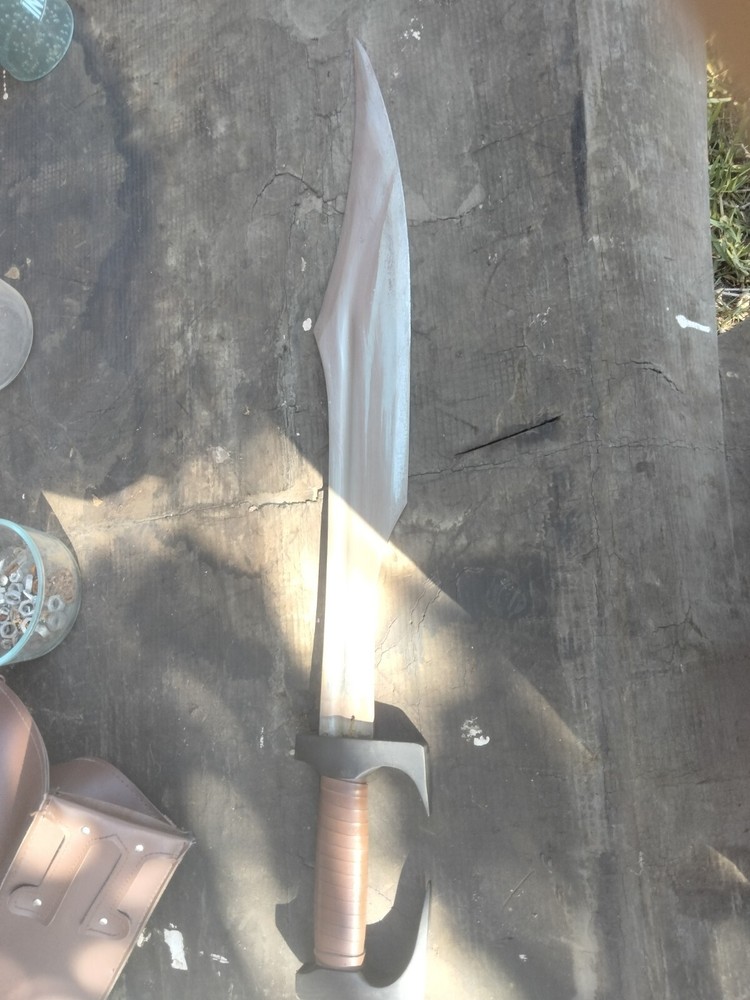 Unsharpened sword with carrying sheath and adjustable shoulder strap