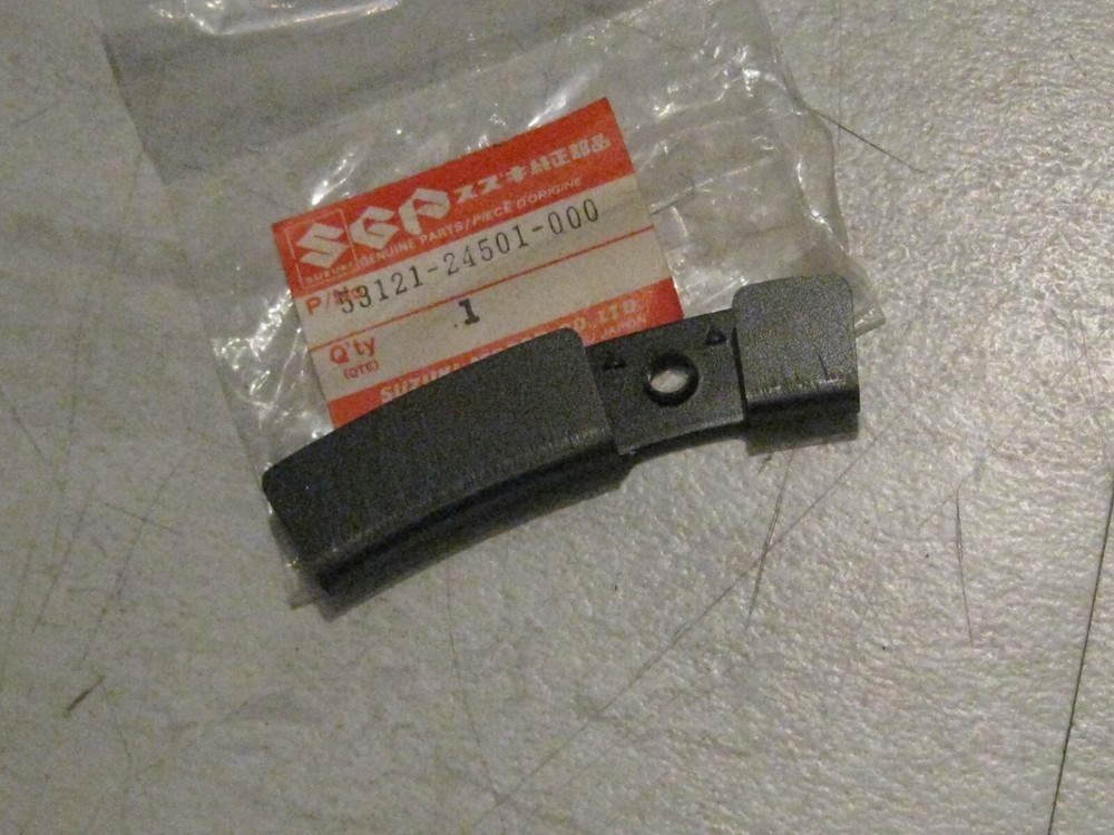SUZUKI LT250E QUADRUNNER/LT250EF LEFT FRONT FENDER SIDE BRACKET NOS!