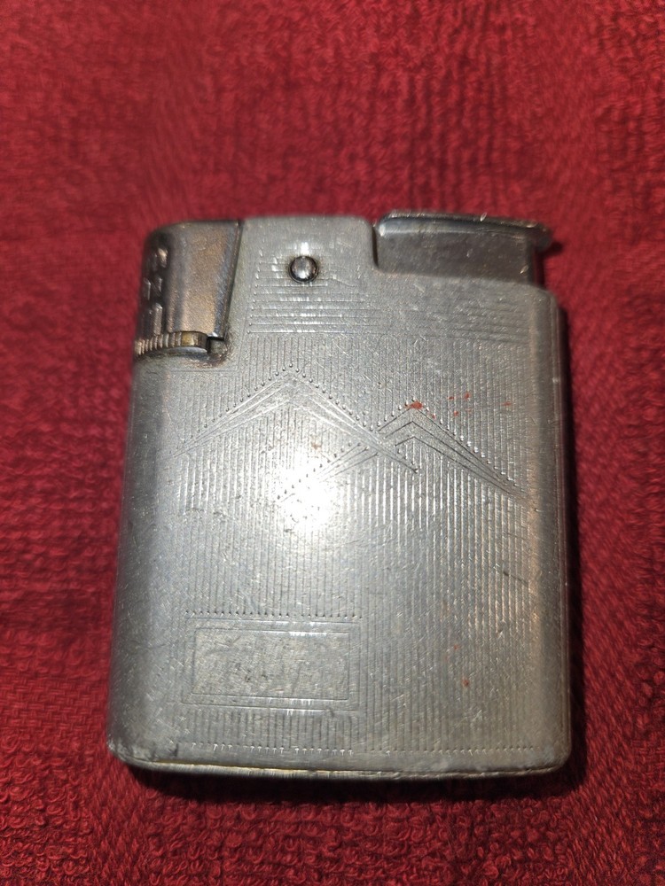 7 sitesVintage Ronson Standard or Adonis pocket lighter.