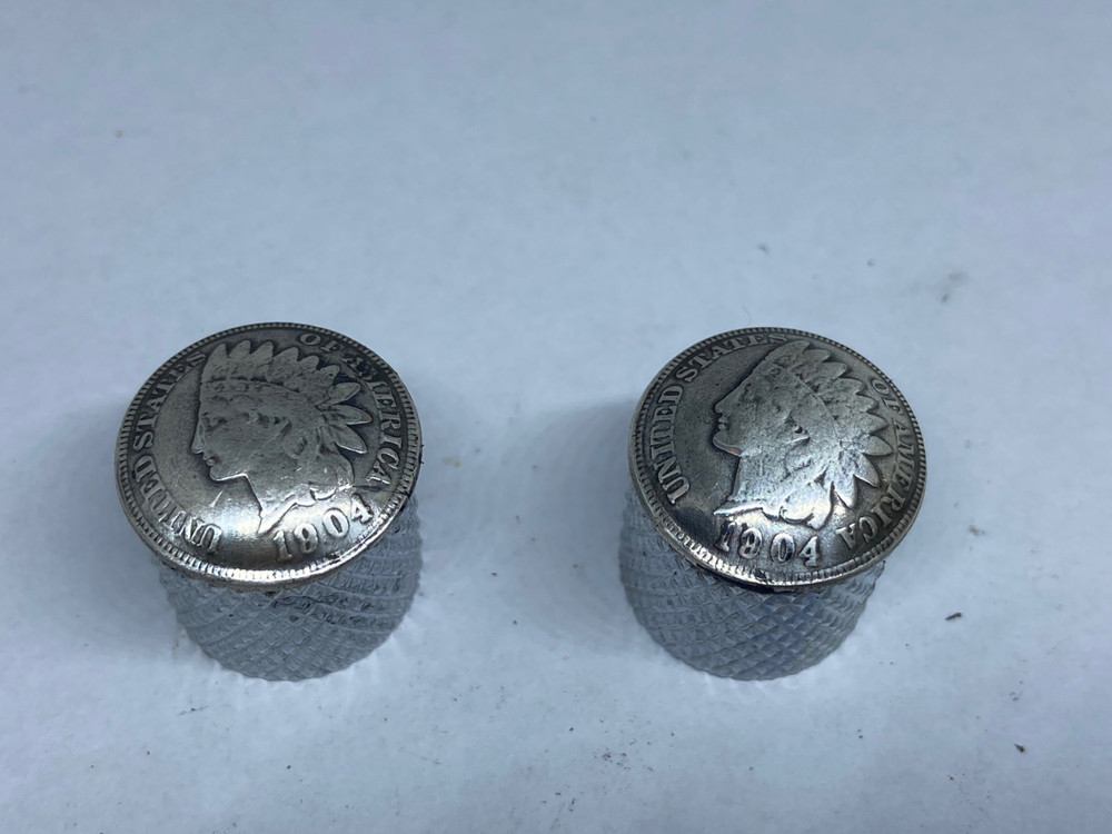 Silver toned Indian penny guitar knobs with knurled sides.
