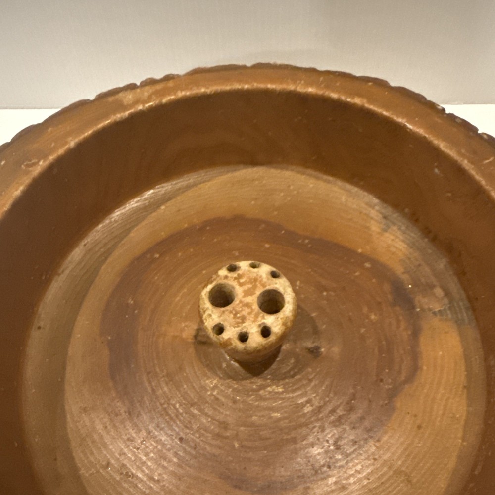 Vintage wooden nut bowl with rustic tree bark,