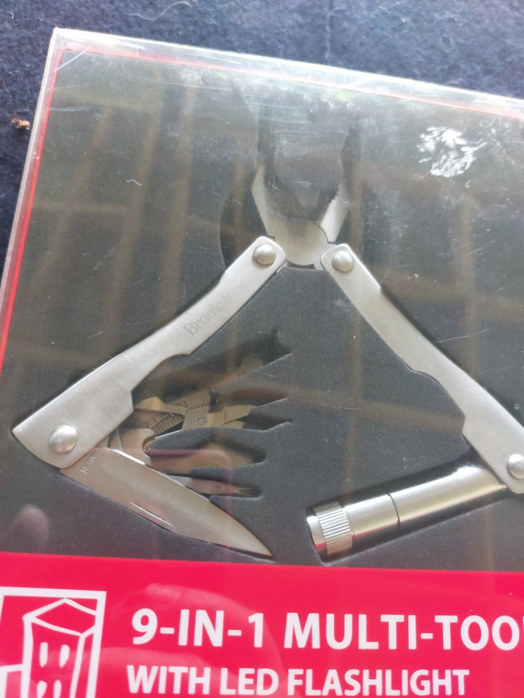 Brookstone® 9-in-1 multi-tool with flashlight pocket size tool NIB