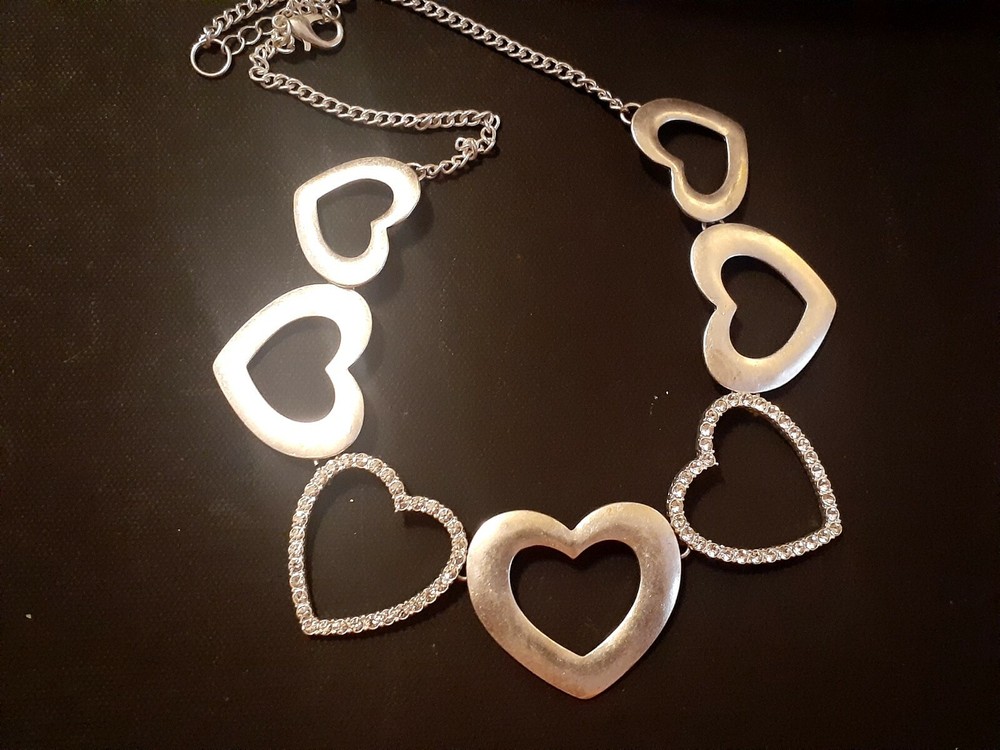 Rhinestone & matte finish multi Heart open work silvertone Necklace. 23"