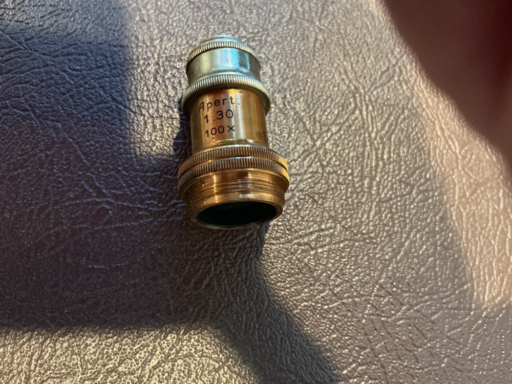 ERNST LEITZ MICROSCOPE WITH 3 OBJECTIVES AND CASE.