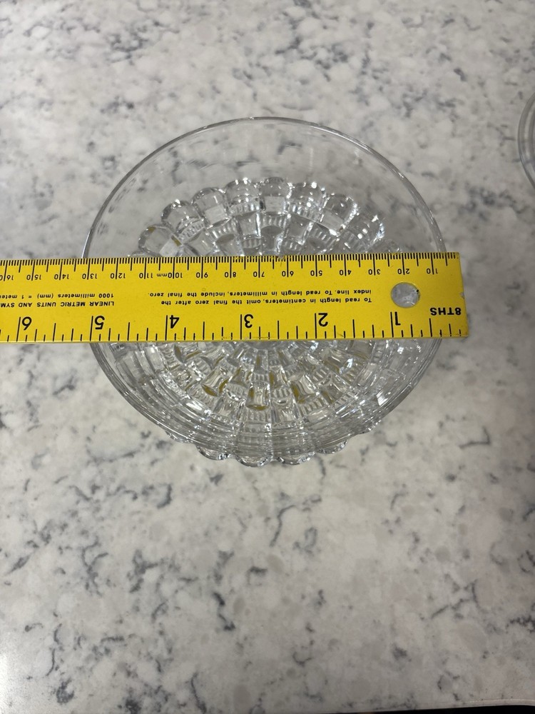 Clear pressed glass covered compote in the 'Cut Log' pattern.