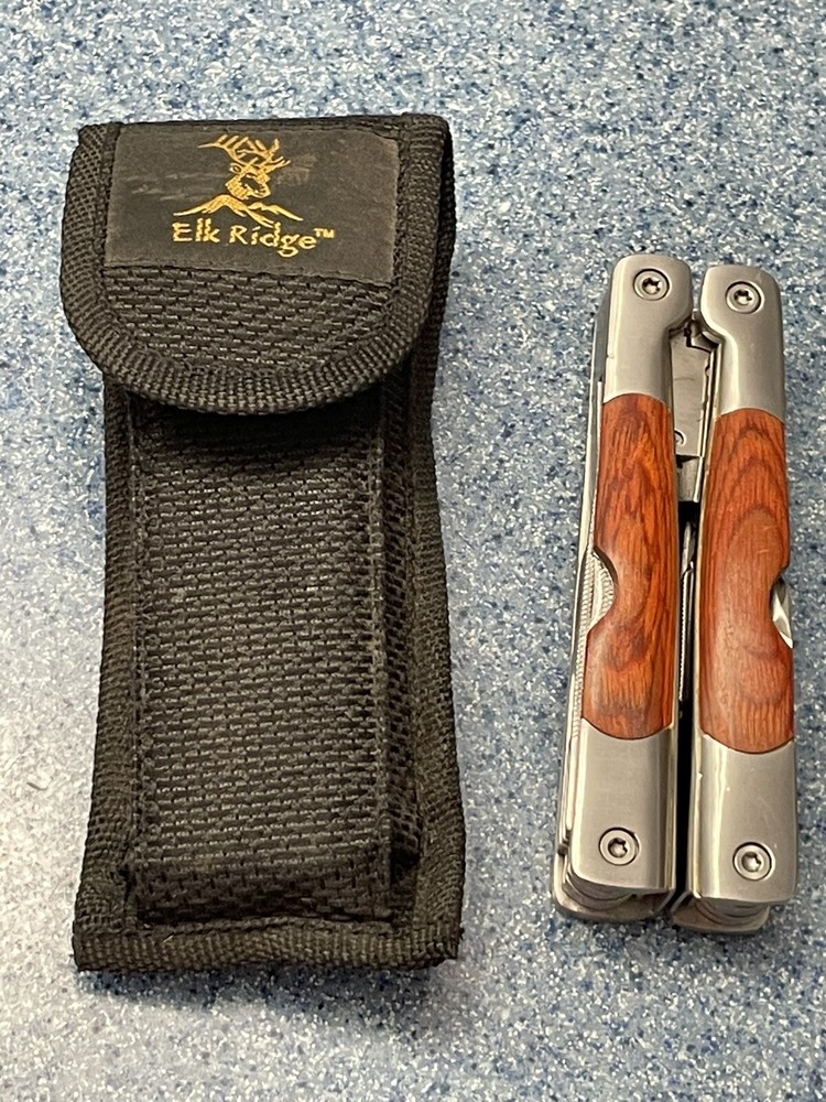 Elk Ridge-Multi Tool With Assorted  Tools -pliers -knife-sockets- Bottle Opener