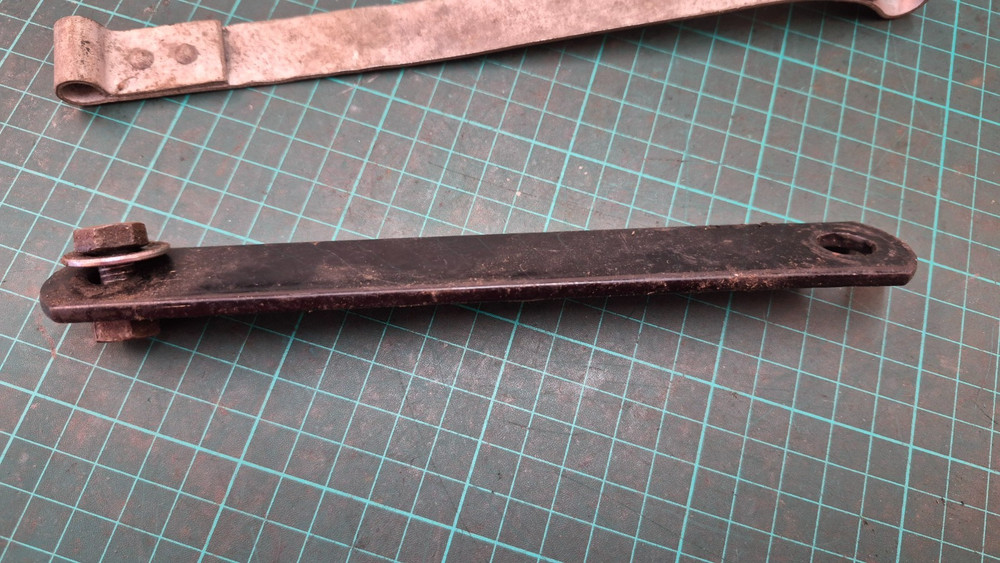BSA battery Strap and piece of tin ware