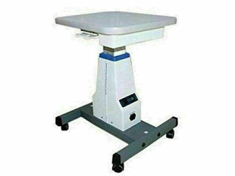 Universal motorized table for slit lamp