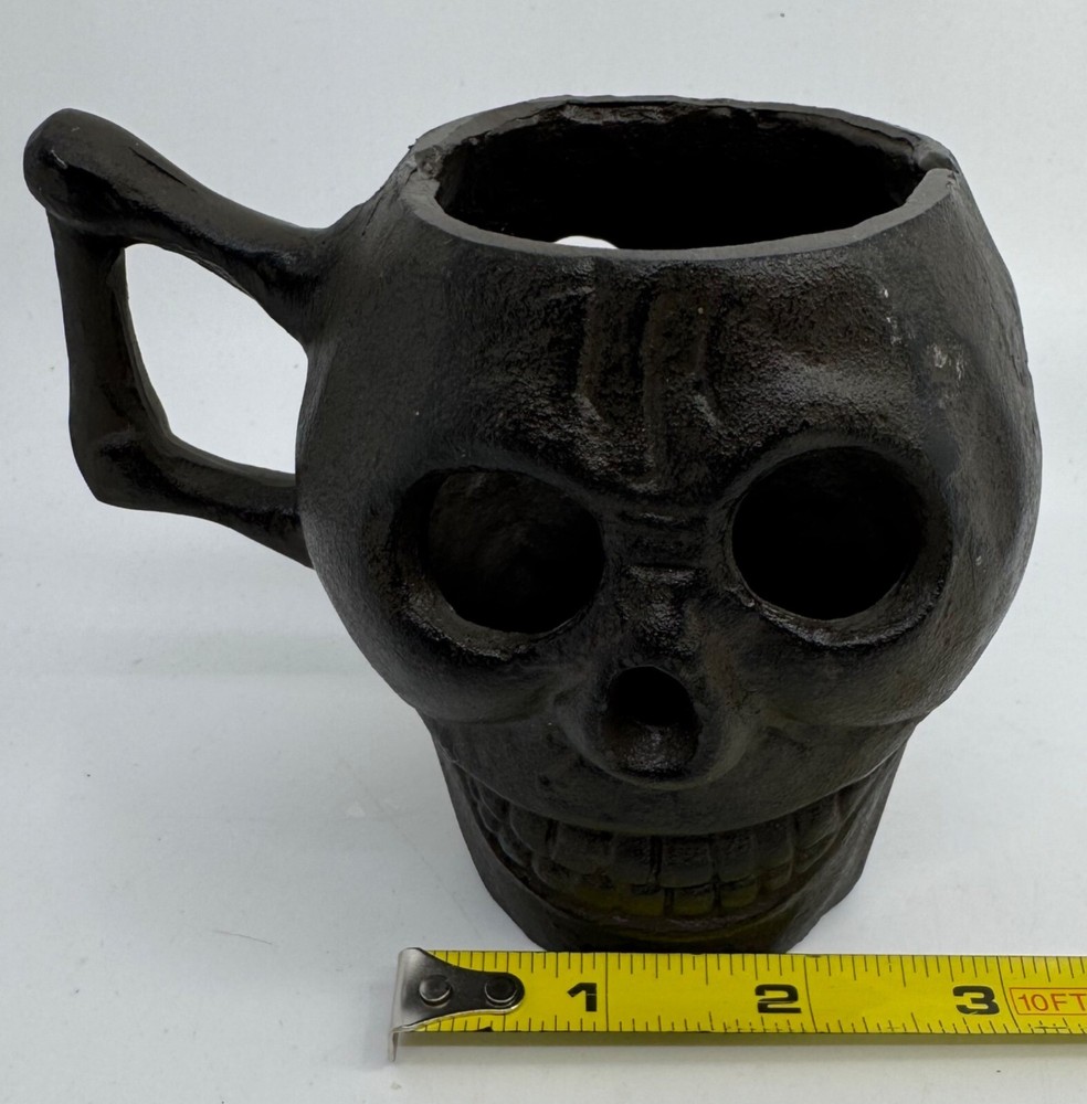 Cast Iron Skull-Shaped Bottomless Mug Thingy With Handle Both Ends And Eyes Open