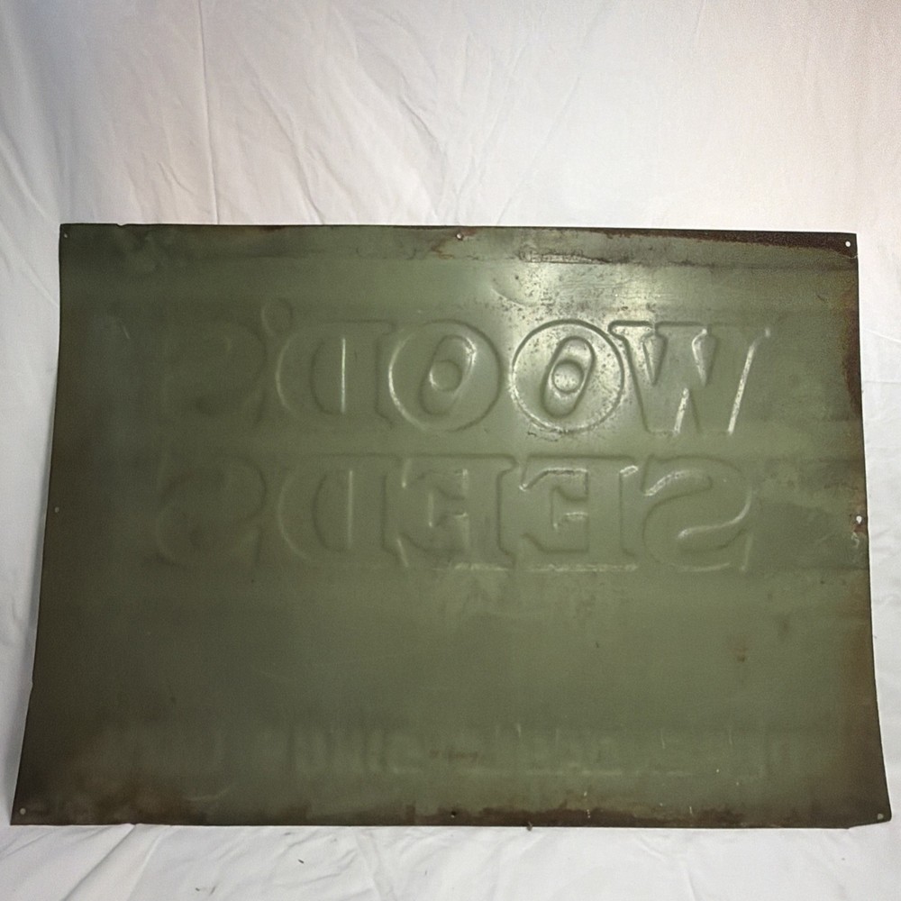 Woods Seeds Embossed Tin Sign