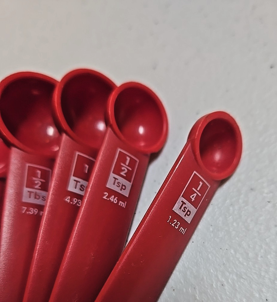Five Piece Red Plastic Measuring Spoon Set; Round