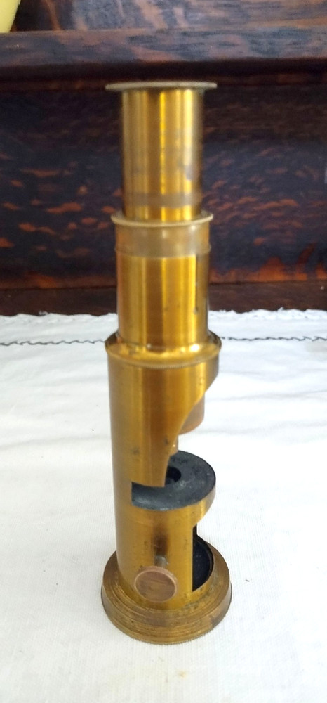 Old brass field microscope