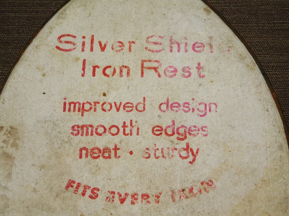 VINTAGE KITCHEN 8 3/4" HIGH SILVER SHIELD IRON REST