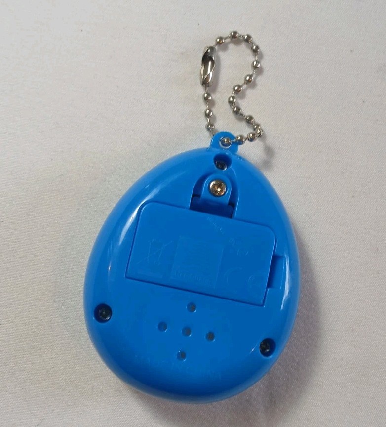 Han Cheng Virtual Pet Electronic Digital Handheld Game Generic Blue Egg Bunny