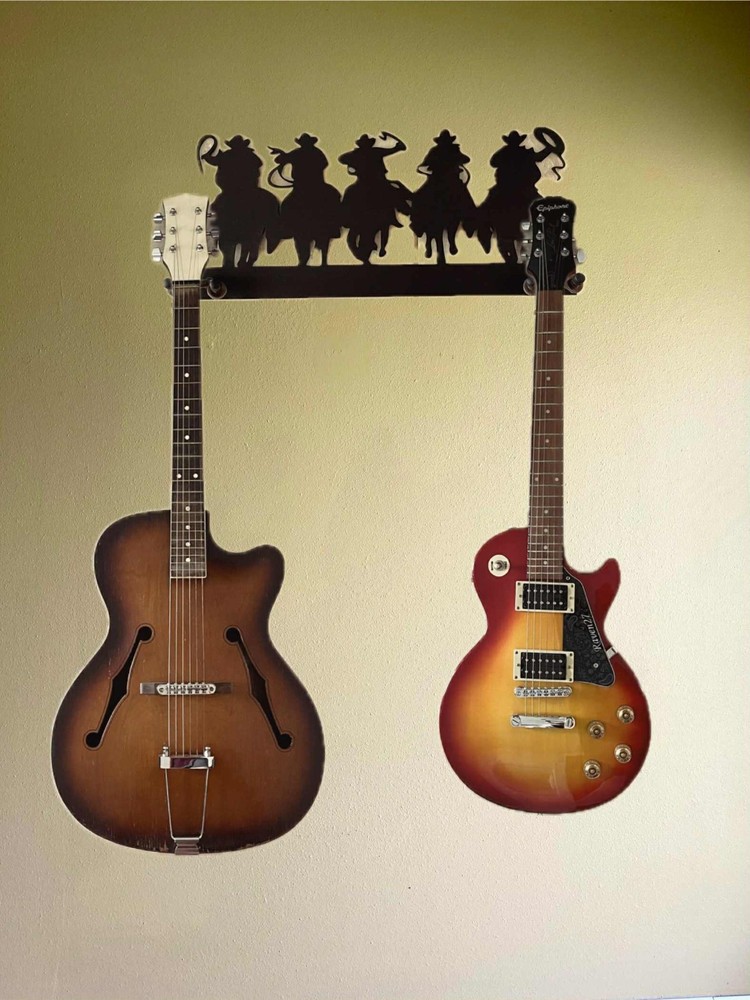Guitar hanger for two. Cowboys