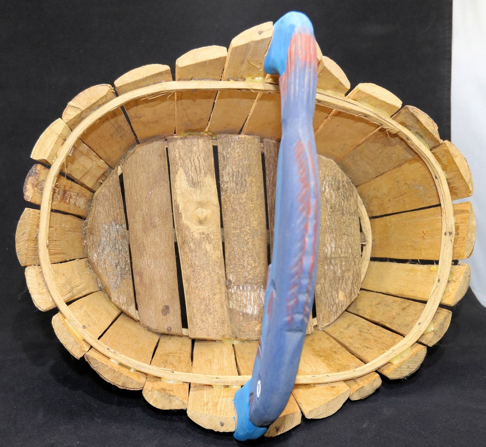 medium-sized oval storage basket features a wood fish handle