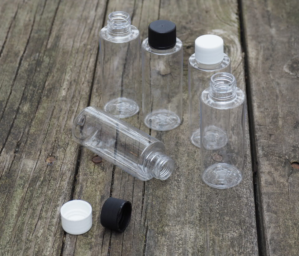 2 Oz. Plastic Clear Cylinder Bottles with white ribbed  cap Travel size 10 PACK
