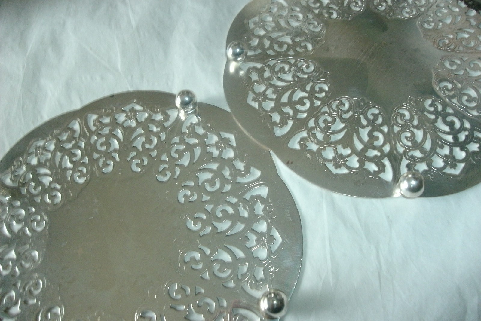 2 VINTAGE FOOTED SILVERPLATE TRIVETS, MADE IN WESTERN GERMANY, 6"