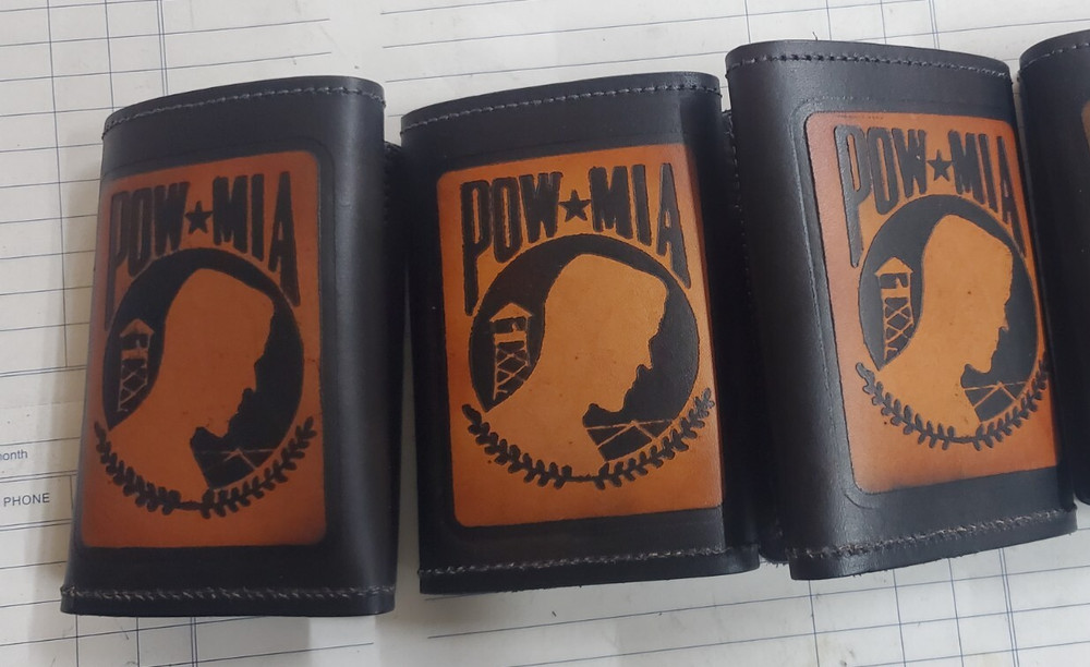 TRI FOLD LEATHER WALLET w/POW*MIA emossed on it