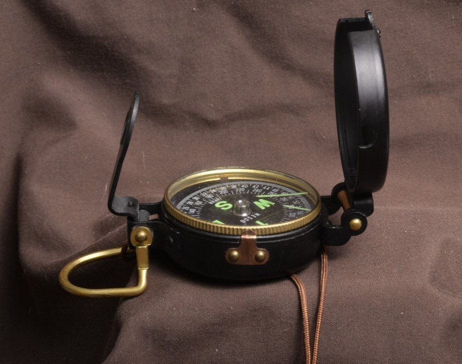 two lensatic compasses one with box