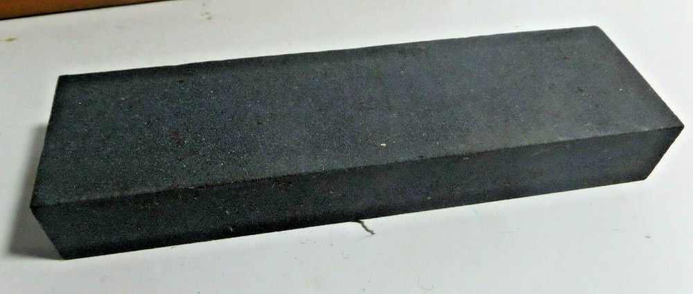 sharpening stone mounted on wood base