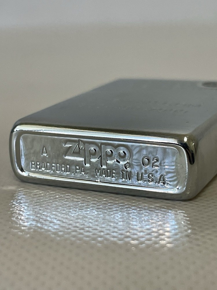 2002 Zippo Lighter engraved “OJIBWAS.COM”