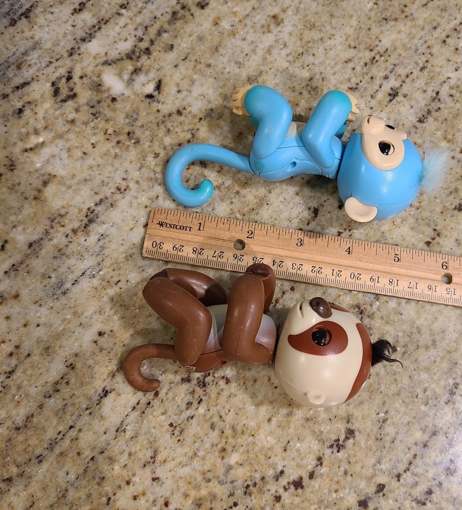 2 Fingerlings Interactive Baby Monkey Blue Brown Toys. Both work tested.