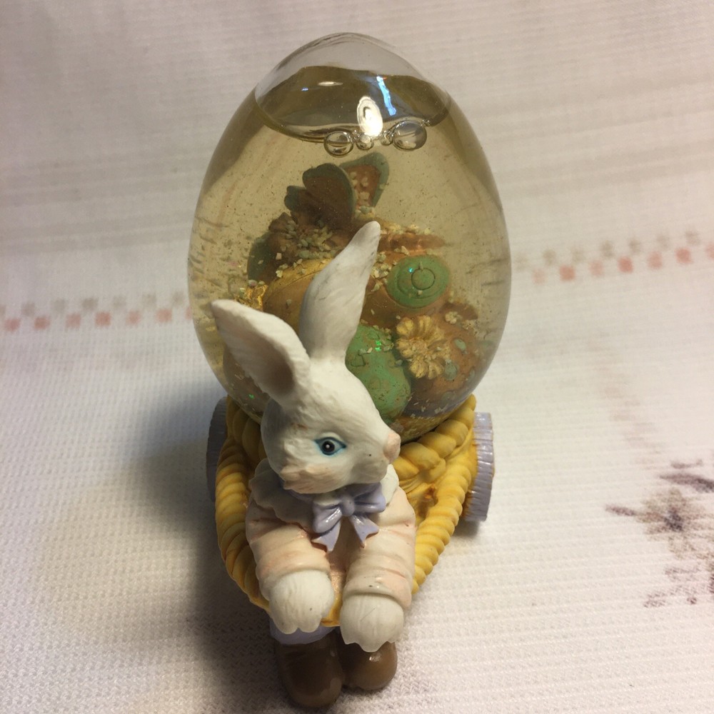 Rabbit Pulling Cart Snow globe Filled With Easter Eggs. Super Cute