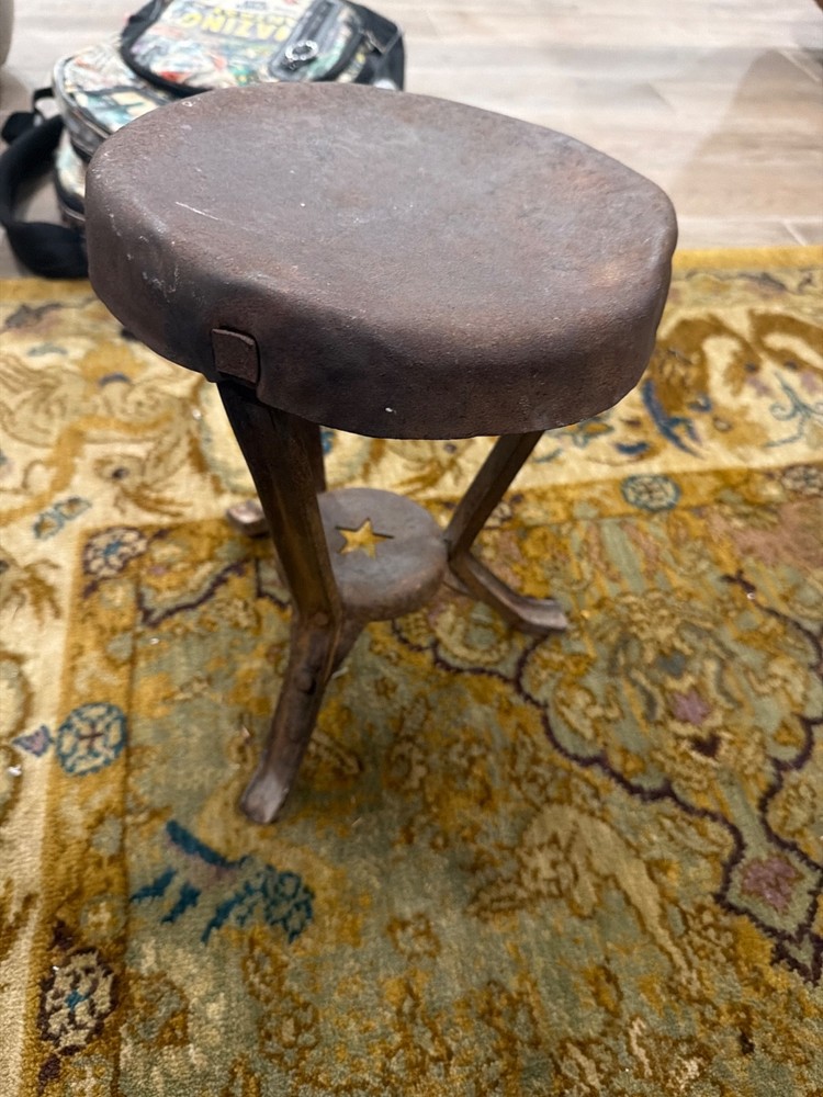 antique metal milking stool