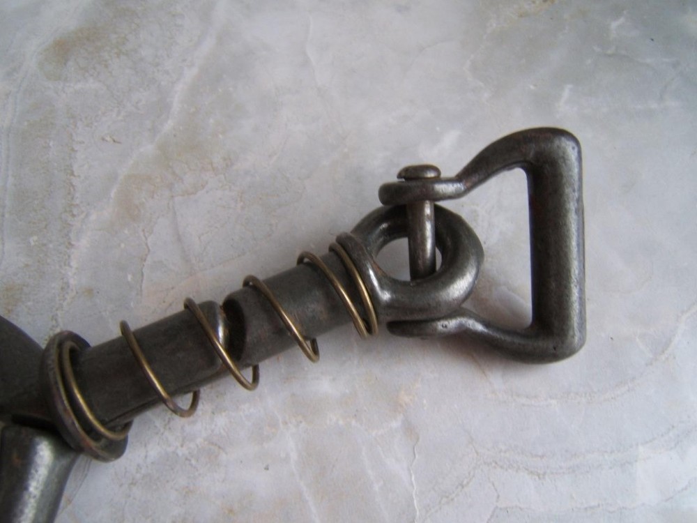 ANTIQUE SPRING-LOADED CAST-IRON BULL LEADING TOOL