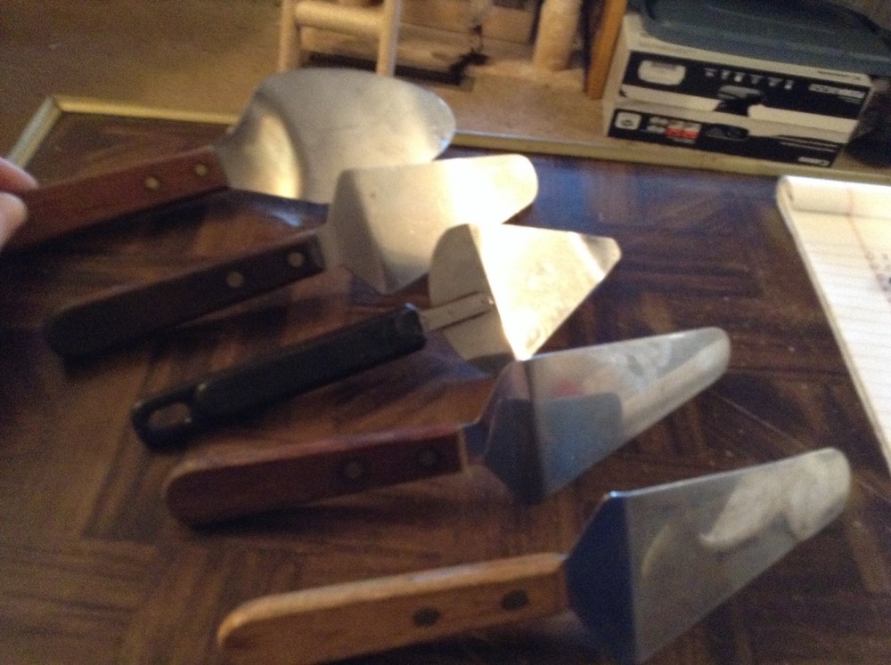Five assorted pie servers