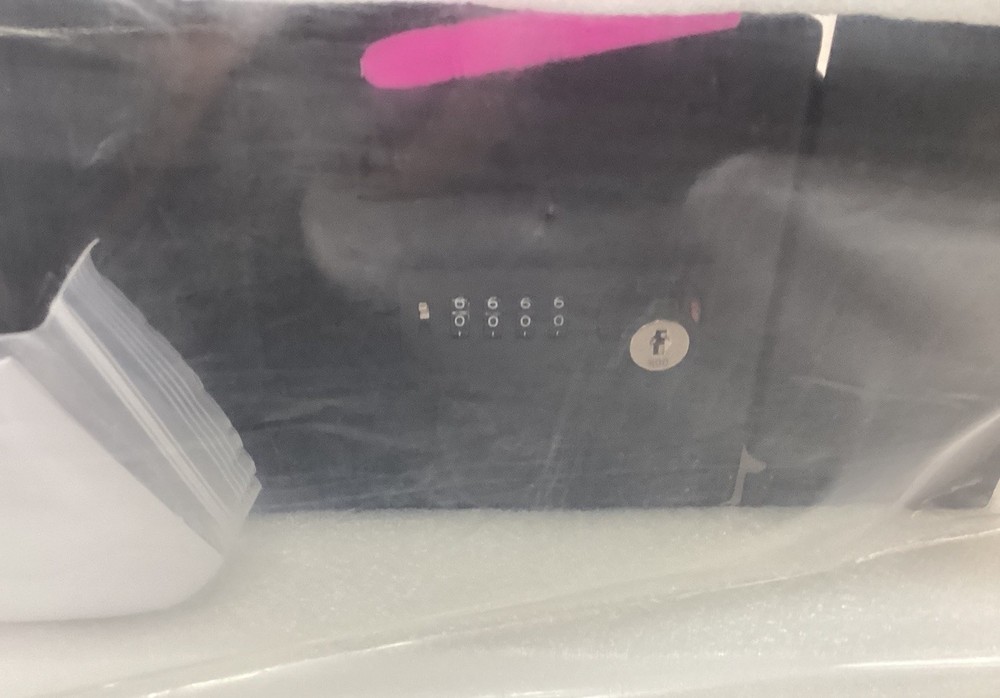 Center Console Gun Safe With Password Retrieval Key.