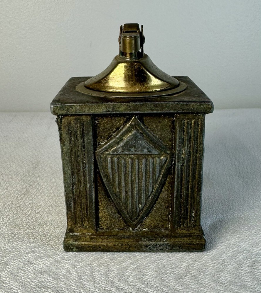Brass Table lighter with crest/ rifle & sword motif