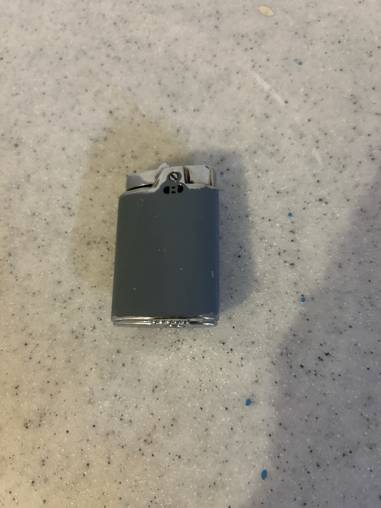 Vintage Ronson Capri Lighter with Three Cherub Design