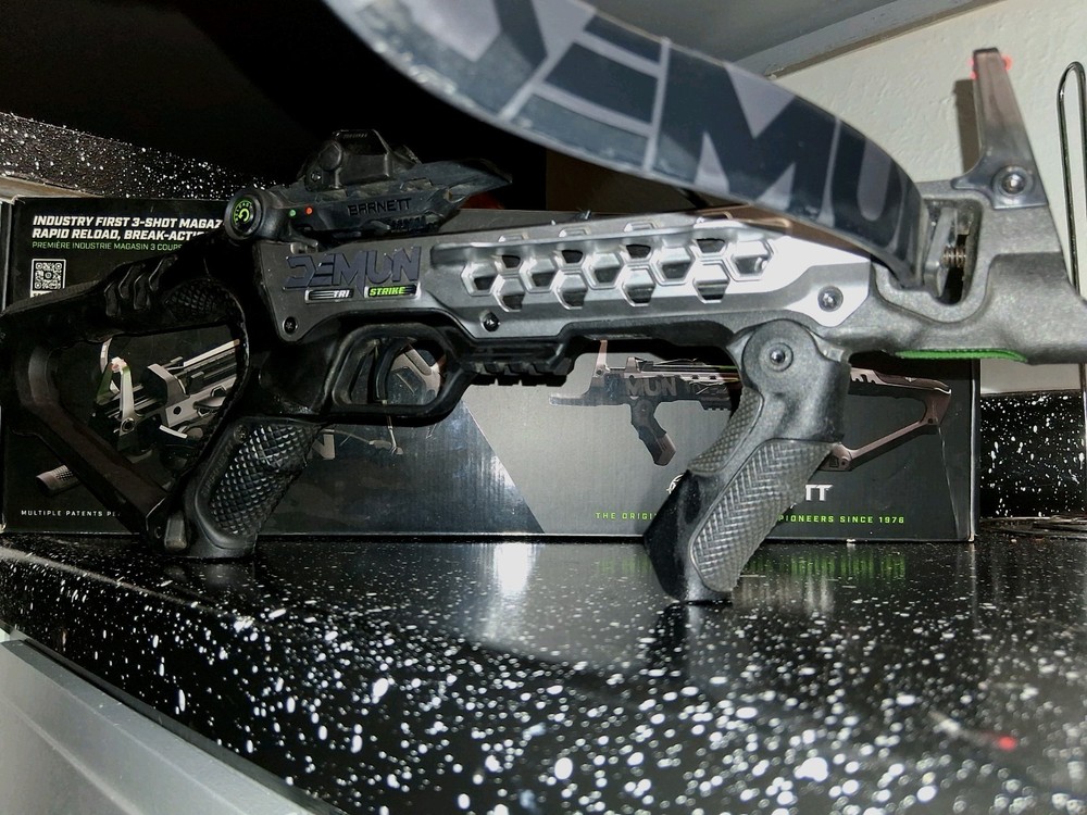 Black crossbow with green