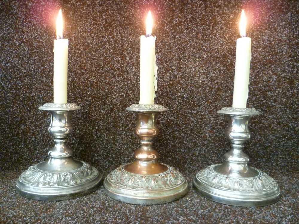 THREE VICTORIAN SILVER ON COPPER CANDLESTICKS, TWO STICKS AND ONE CANDELABRA