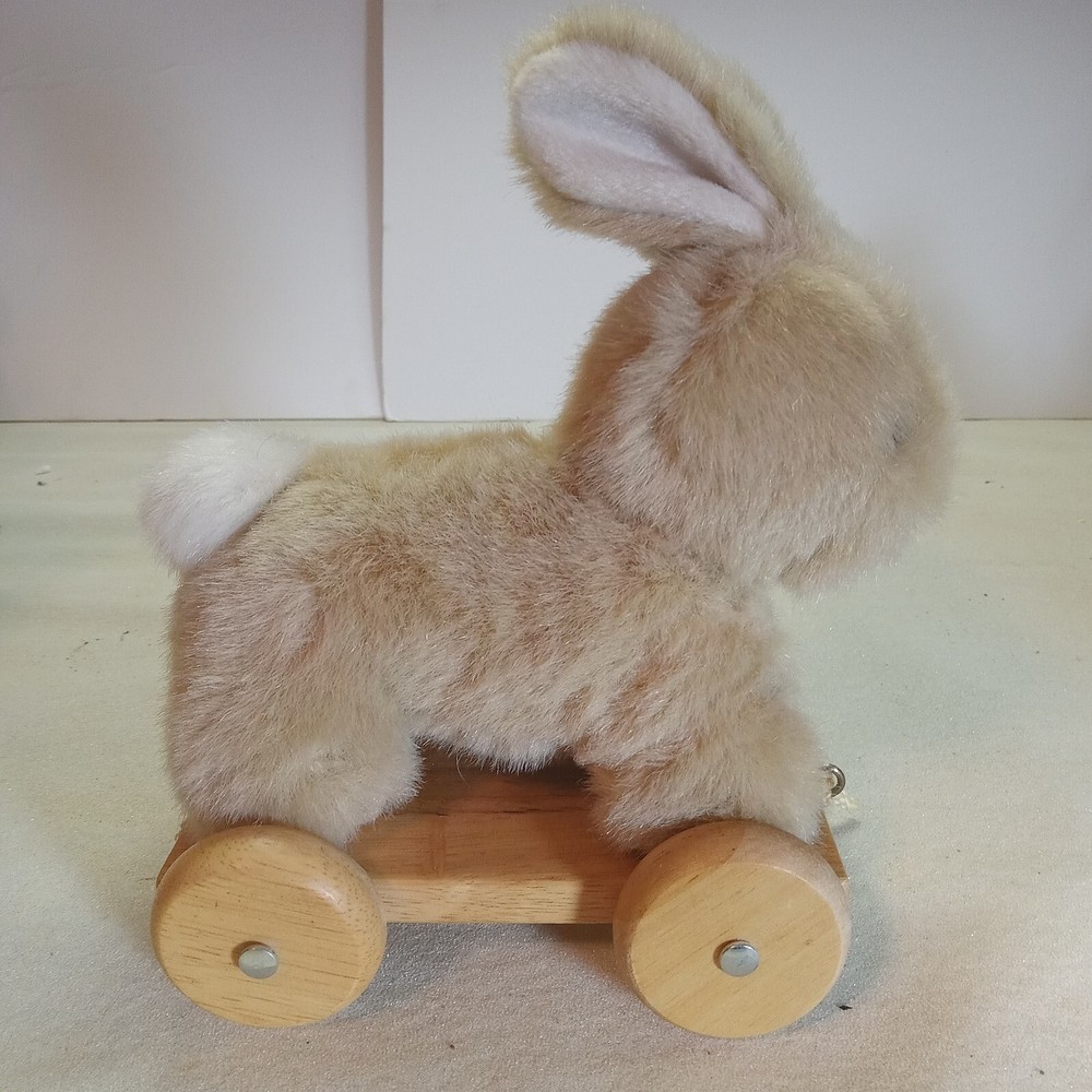 A bunny & duck on wheels pull toy