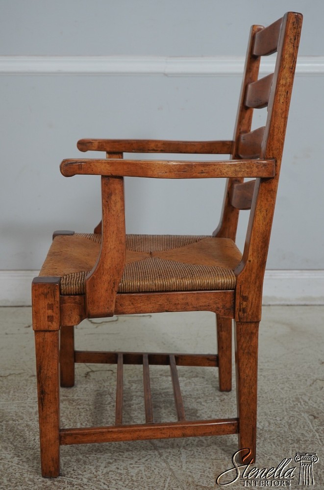 68471: Pair GUY CHADDOCK Distressed Ladderback Armchairs