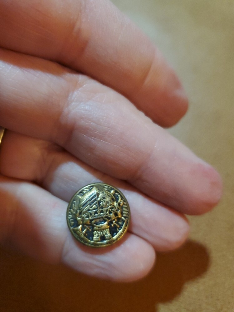 4 miscellaneous antique brass buttons
