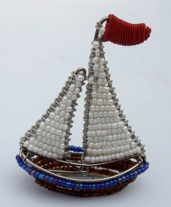 Beaded sea: Miniature sailboat